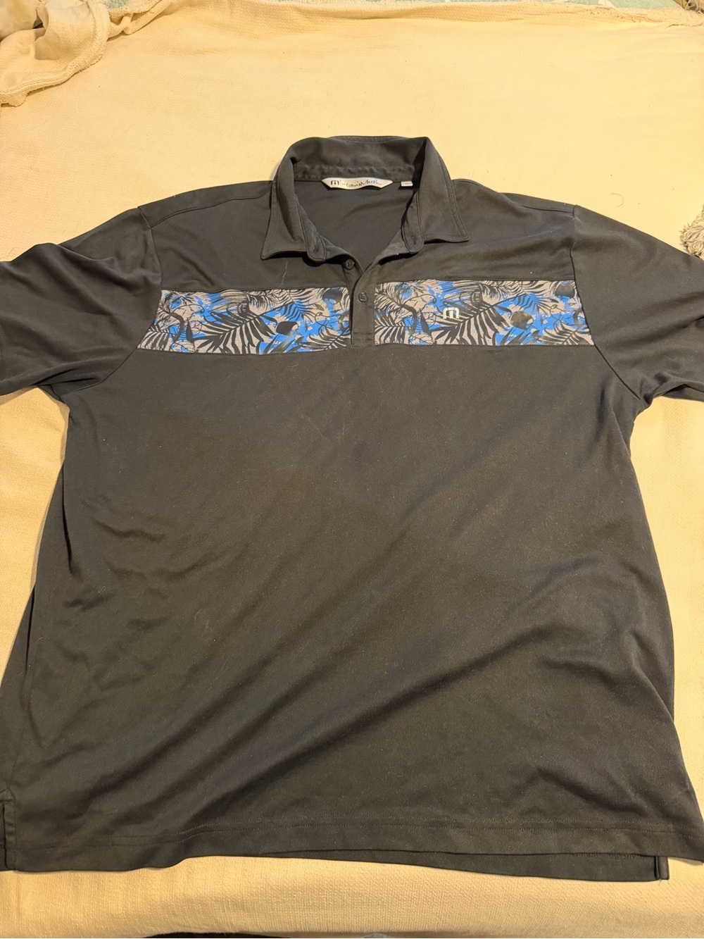 Travis Mathew Black Polo with Blue Floral Chest Panel